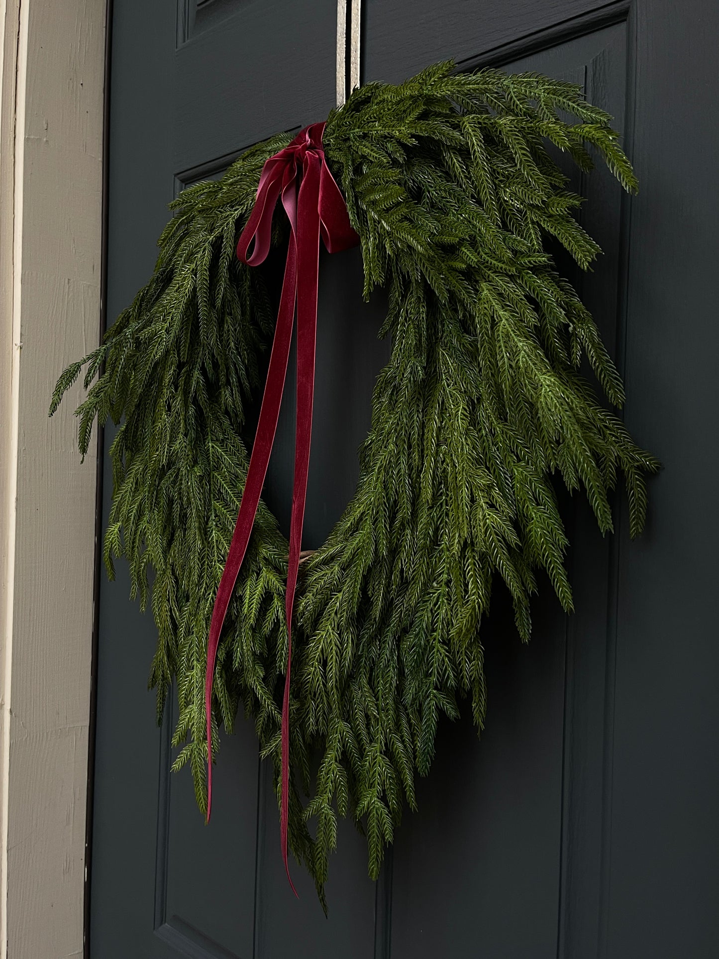 Faux Norfolk Pine Wreath with Red Velvet Bow