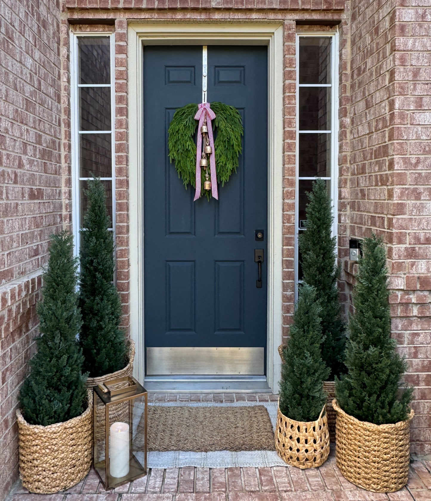 Faux Norfolk Pine Wreath with Bells and Red & White Striped Bow
