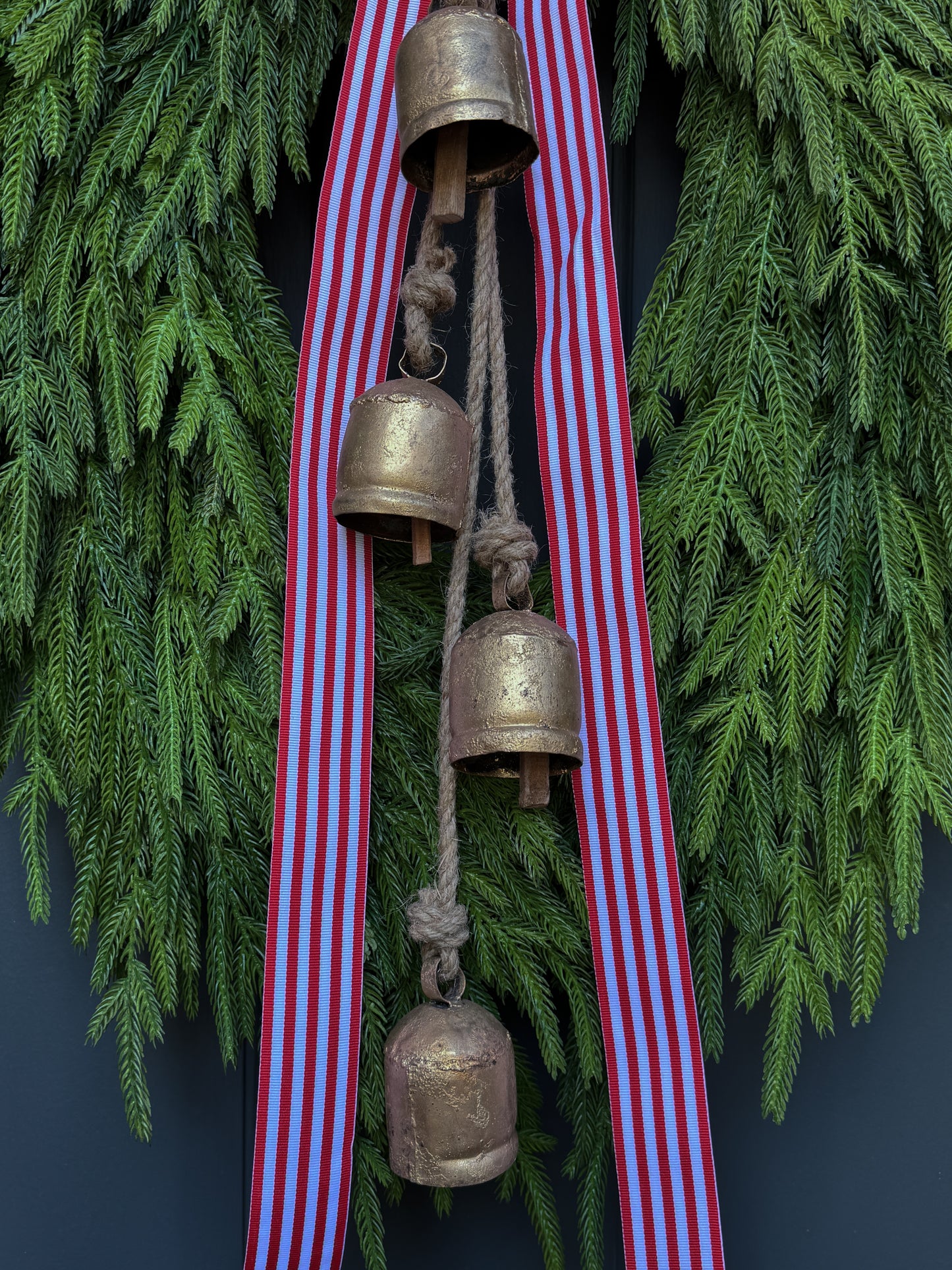 Faux Norfolk Pine Wreath with Bells and Red & White Striped Bow