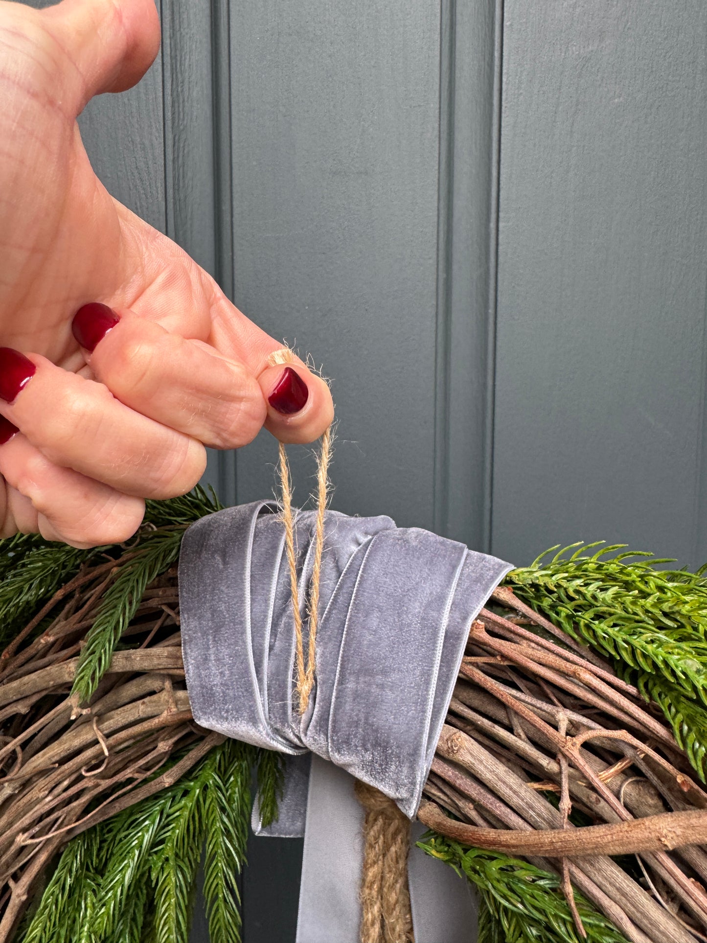 Faux Norfolk Pine Wreath with Bells and Red & White Striped Bow