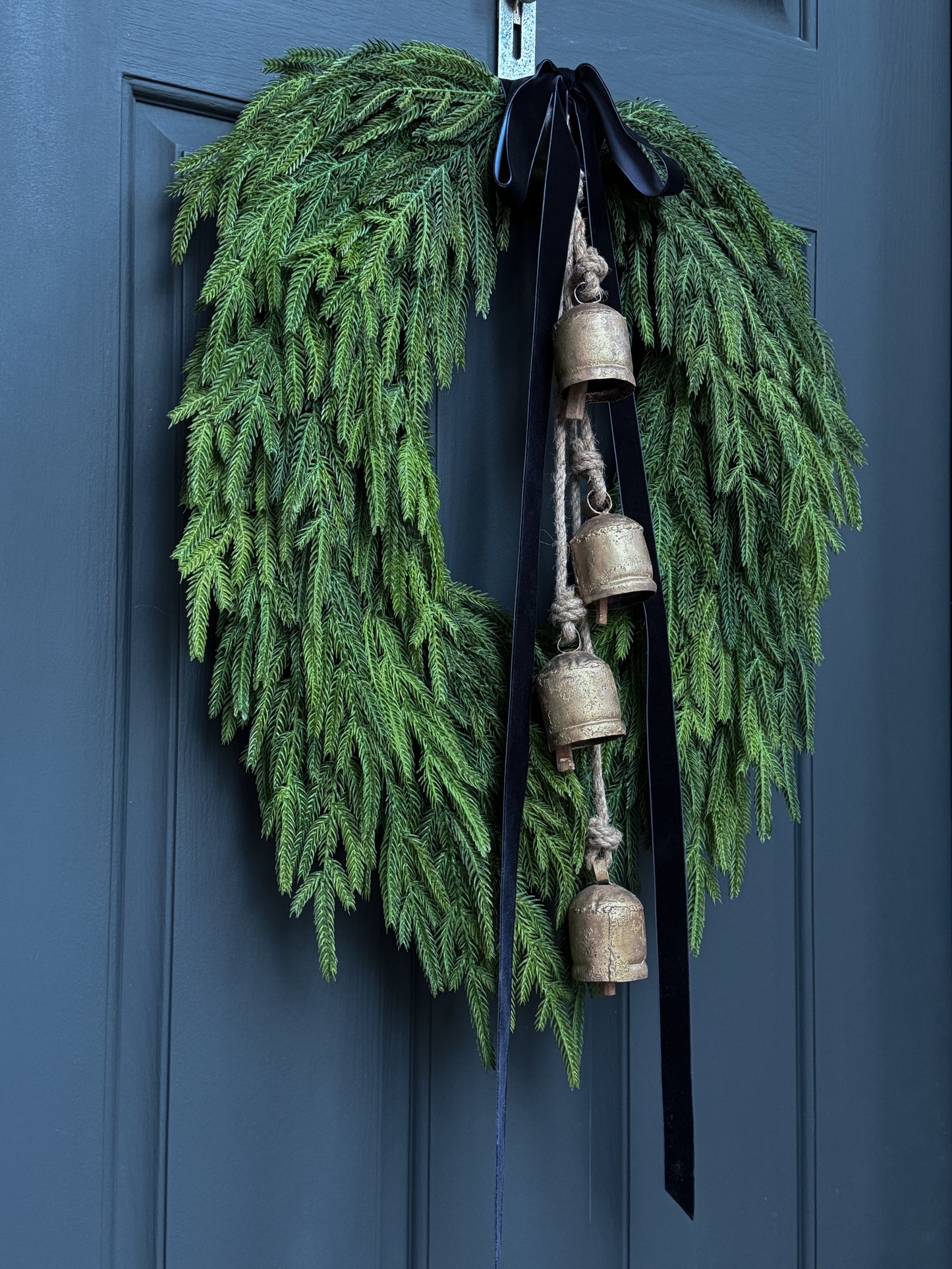 Faux Norfolk Pine Wreath with Bells and Red & White Striped Bow