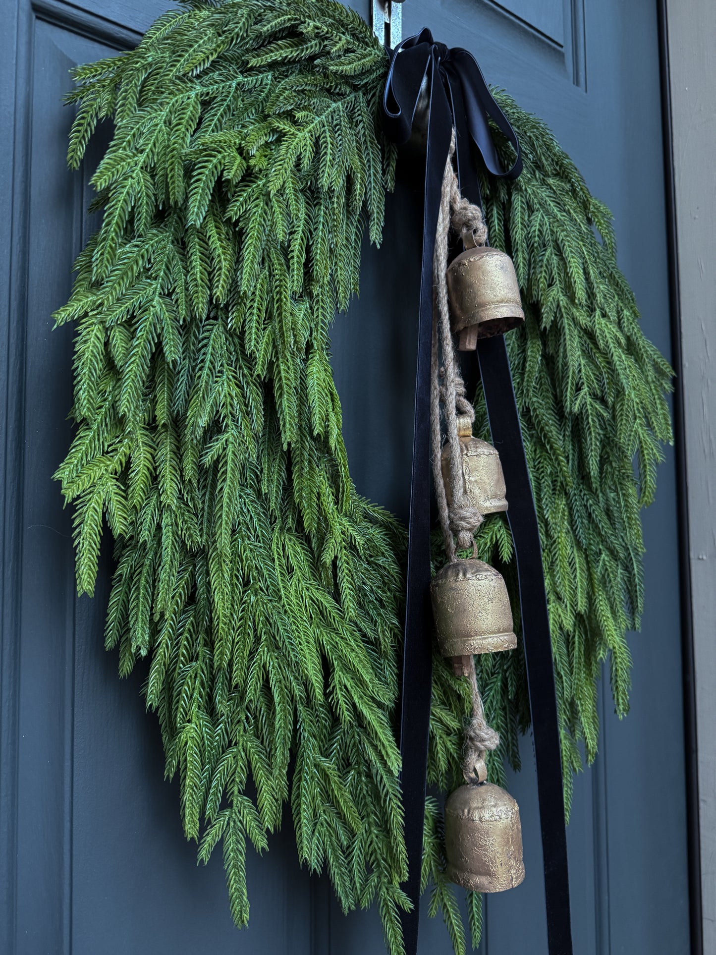 Faux Norfolk Pine Wreath with Bells and Red & White Striped Bow