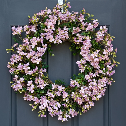 24" spring front door wreath with lavender blossoms and green leaves.