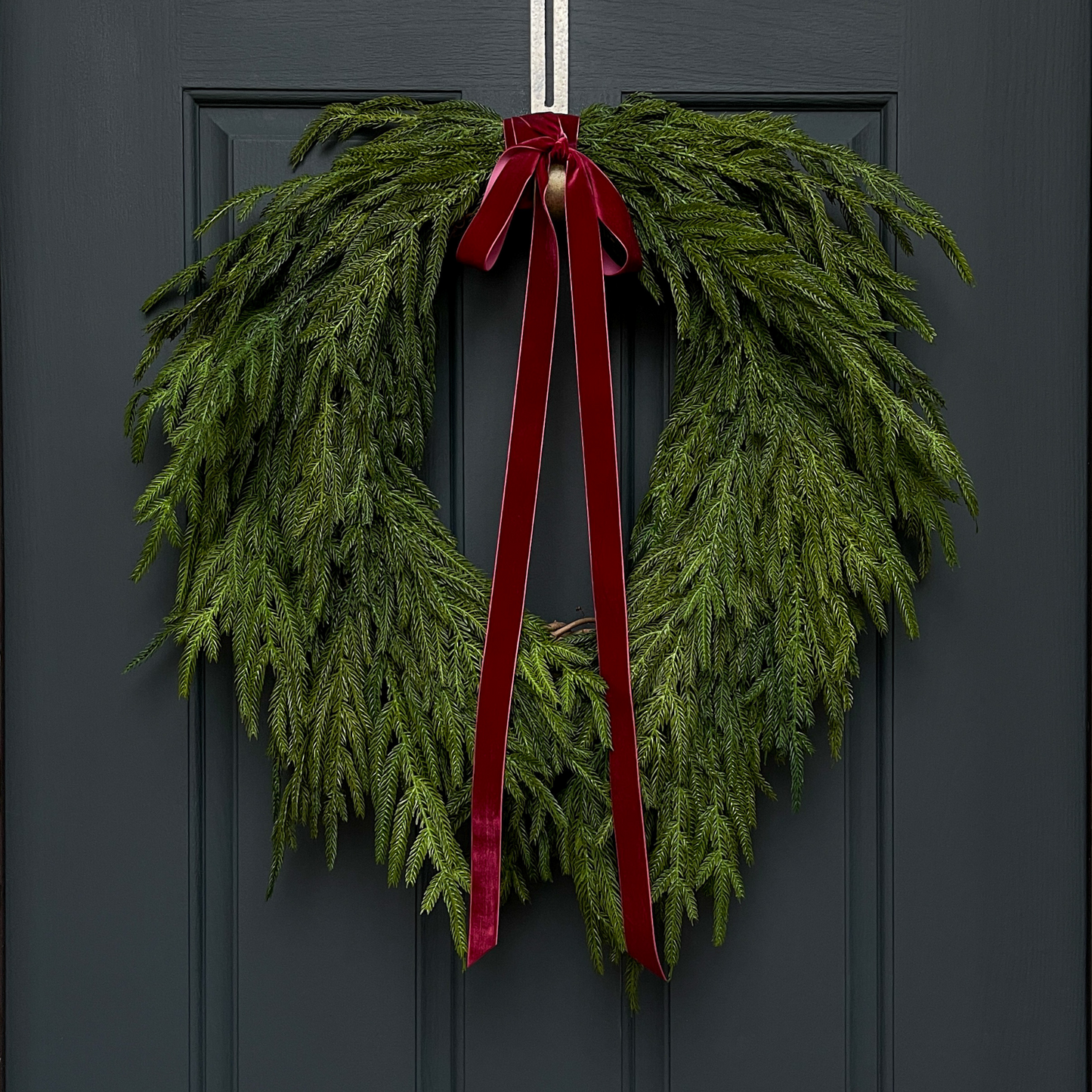 Faux Norfolk Pine Wreath with Red Velvet Bow