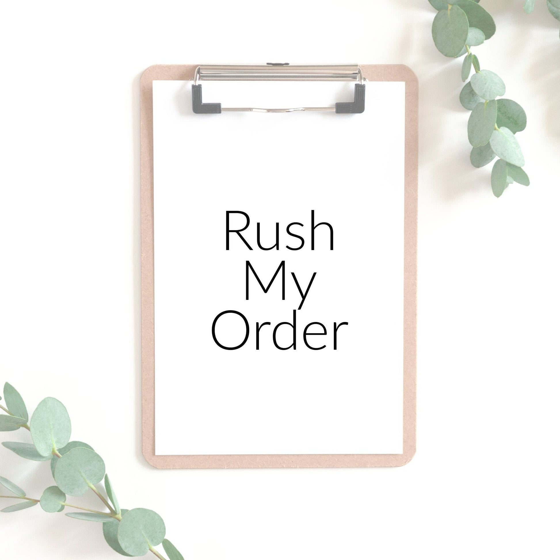 Image of a clip board with a piece of white paper that says rush my order.